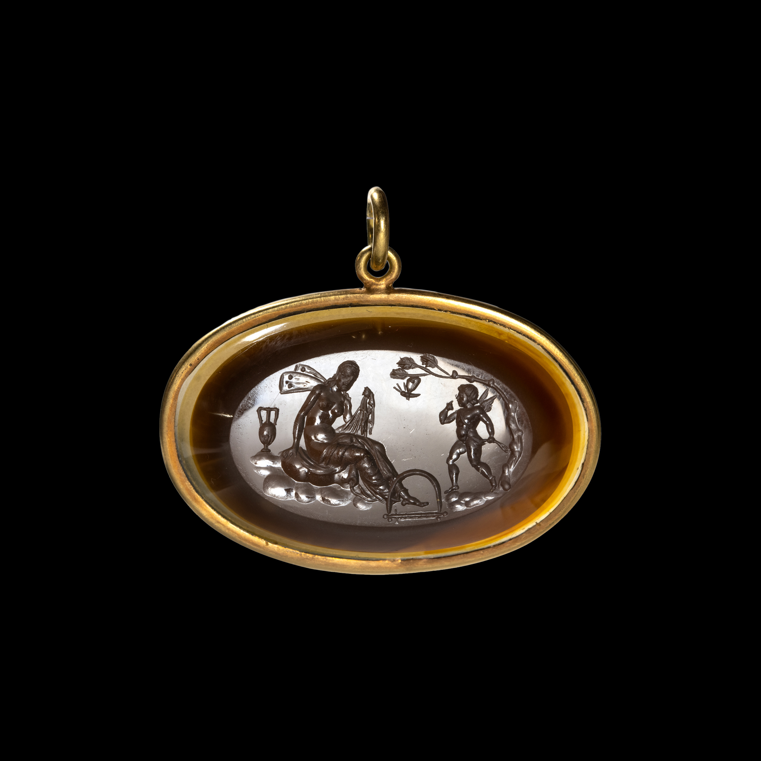 A gold pendant set with a large Neoclassical agate intaglio. Cupid saving Psyche. 